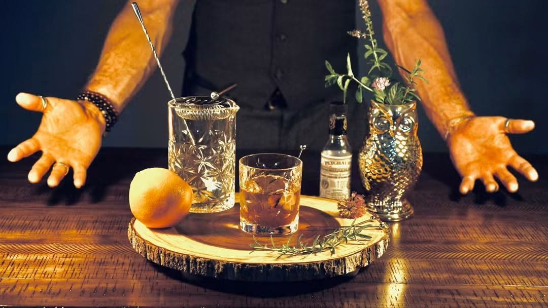The Smoked Old Fashioned with orange, rosemary, and bar tools